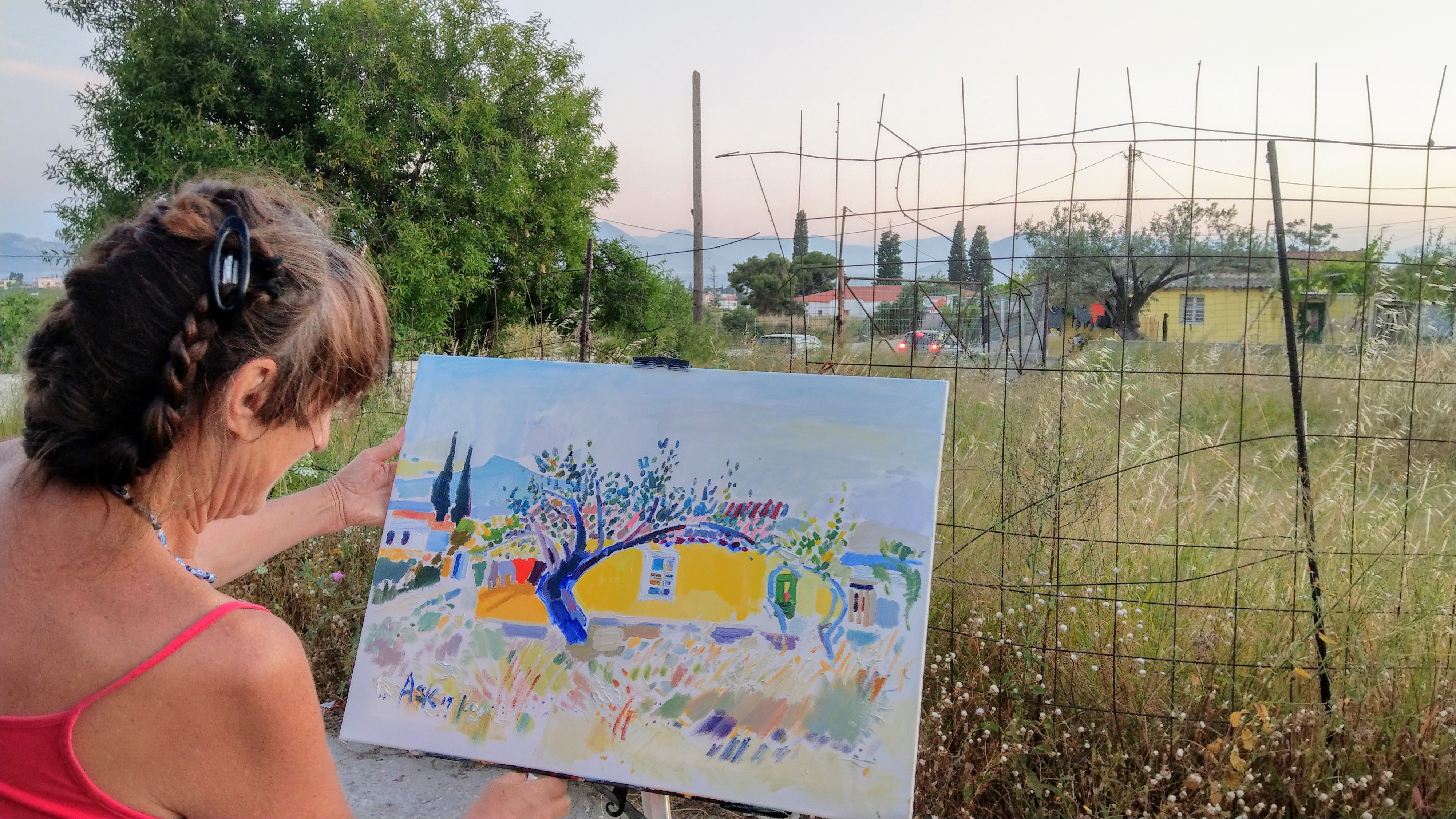 Ask with her oil painting - The actual yellow house itself is seen too in the distance